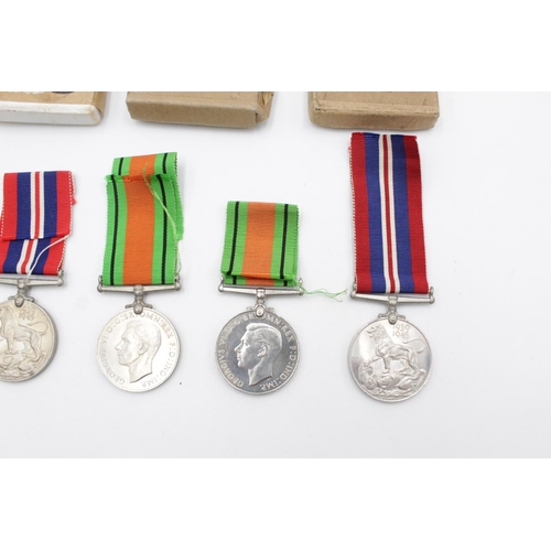 94 - Three boxed WWII medal sets to include Defence and War