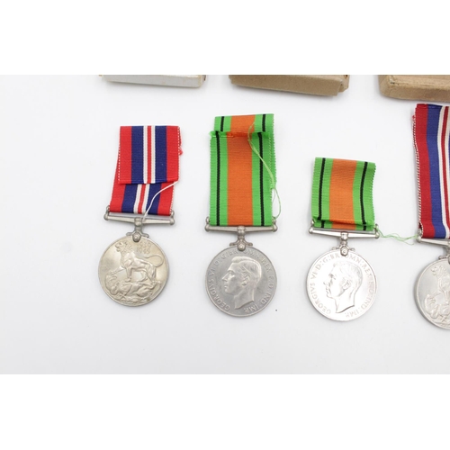 94 - Three boxed WWII medal sets to include Defence and War