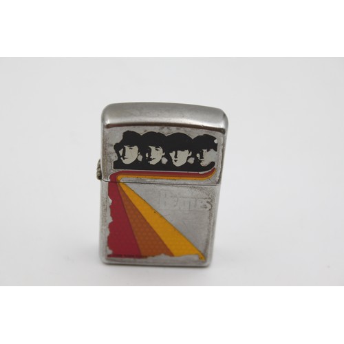 227 - Two assorted Zippo cigarette lighters, one Fender and one The Beatles