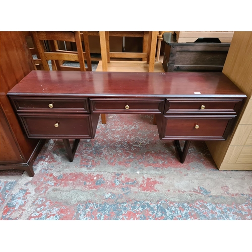 A Rossmore Furniture mahogany five drawer dressing table approx. 74cm