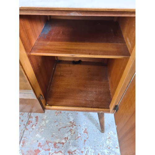 1108 - A Beautility walnut sideboard with two central drawers, two cupboard doors and two lower drawers - a... 