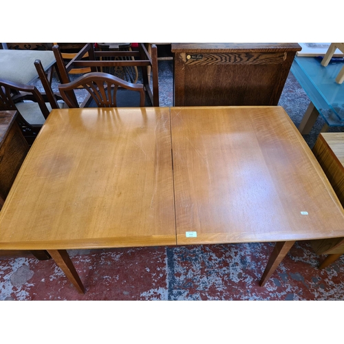 1112 - A mid 20th century beech and walnut rectangular extending dining table - approx. 73cm high x 86cm wi... 