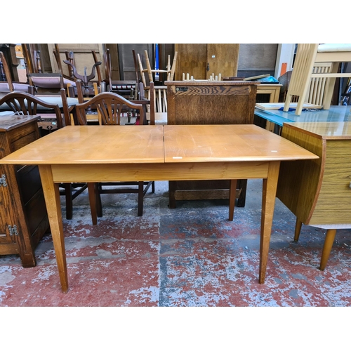 1112 - A mid 20th century beech and walnut rectangular extending dining table - approx. 73cm high x 86cm wi... 