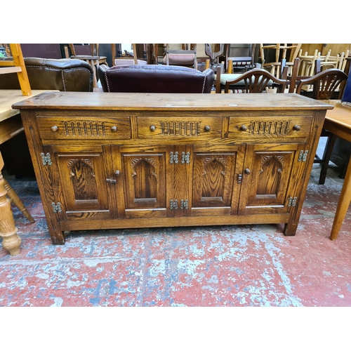 1114 - A Webber Furniture oak sideboard with three upper drawers and four lower cupboard drawers - approx. ... 