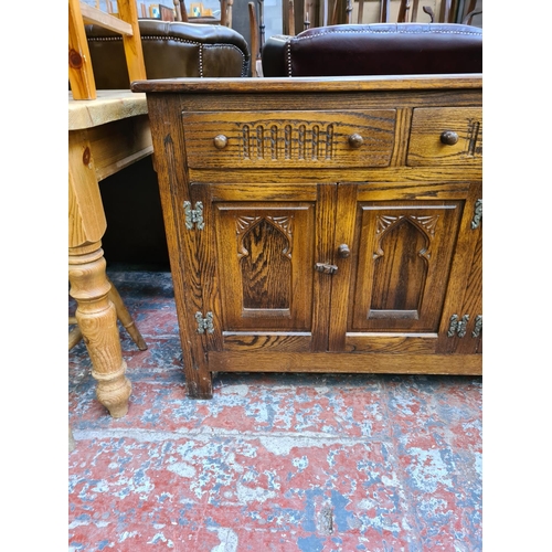 1114 - A Webber Furniture oak sideboard with three upper drawers and four lower cupboard drawers - approx. ... 