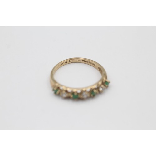 9 - A hallmarked London 9ct gold emerald and clear gemstone seven stone ring, size O½ - approx. gross we... 