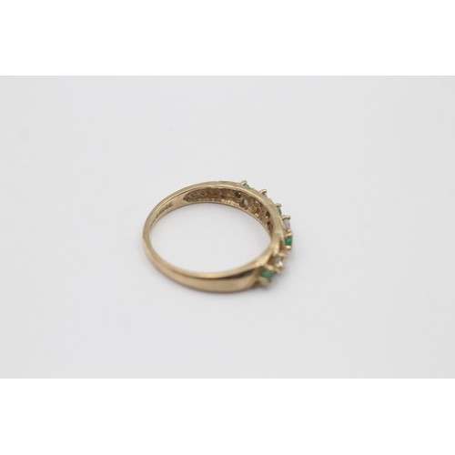 9 - A hallmarked London 9ct gold emerald and clear gemstone seven stone ring, size O½ - approx. gross we... 