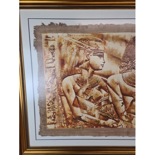 1275 - A gilt framed Egyptian print on parchment paper - approx. 120cm wide x 91cm high