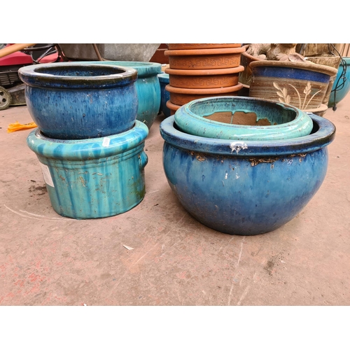 Four assorted drip glazed plant pots