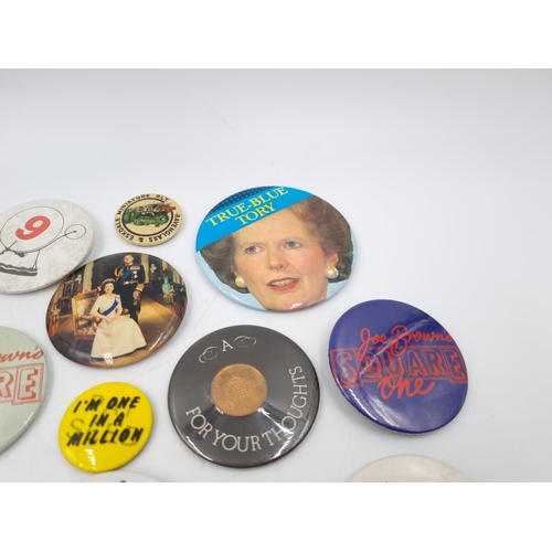 120B - A collection of assorted vintage pin badges to include 