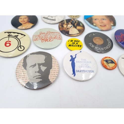 120B - A collection of assorted vintage pin badges to include 