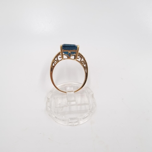 22 - A 9ct gold blue topaz and diamond shouldered ring, size P½ - approx. gross weight 3.85 grams