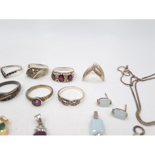 23 - A collection of 925 silver jewellery to include nine various rings, earrings, pendants etc. - approx... 