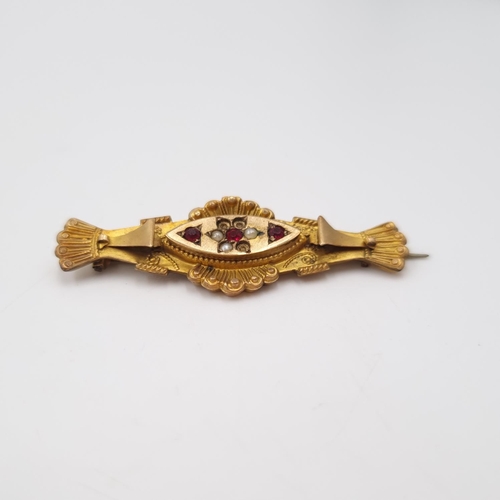 26 - A late 19th/early 20th century 9ct gold seed pearl and red gemstone bar brooch - approx. 4.5cm wide ... 