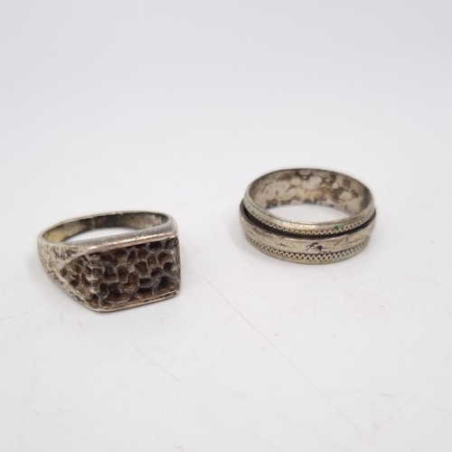 28 - Two vintage white metal rings, one stamped silver with textured design - approx. gross weight 6 gram... 