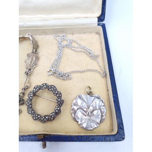 52 - A collection of white metal jewellery to include silver and marcasite circular pin brooch, chain nec... 