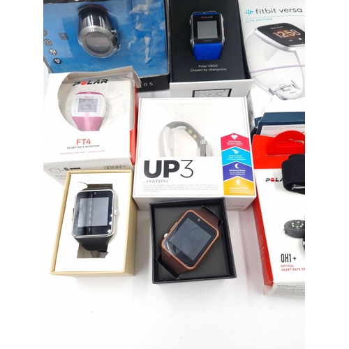 60 - A collection of fitness watches to include Fitbit Versa Lite Edition, Garmin Forerunner 405, Jawbone... 