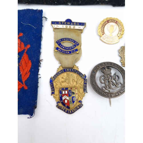 81A - A collection of assorted vintage medals and badges to include Manchester United Football Club Europe... 