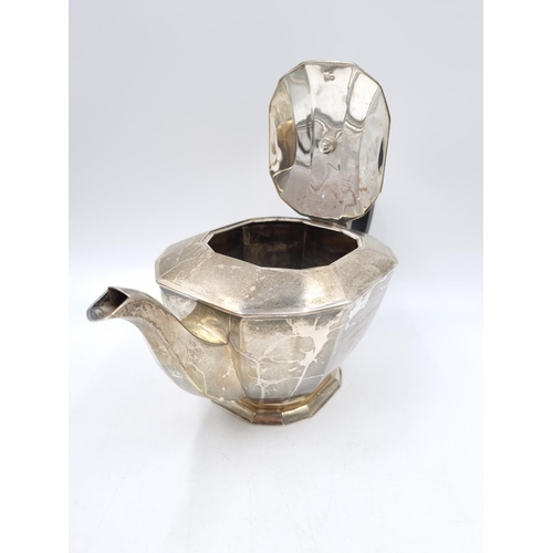 152 - A hallmarked Sheffield silver three piece tea set comprising milk jug, twin handled sugar bowl and t... 