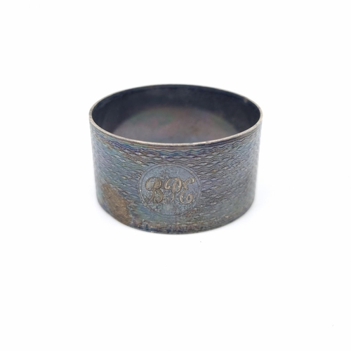 158 - Two pieces of hallmarked silver, one Birmingham napkin ring, dated 1933 - approx. gross weight 20g a... 