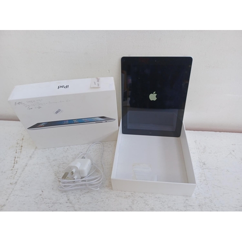 A boxed Apple Fourth Generation iPad with charger