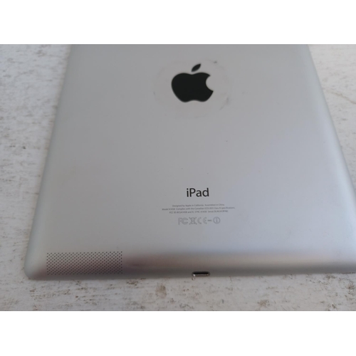 A boxed Apple Fourth Generation iPad with charger