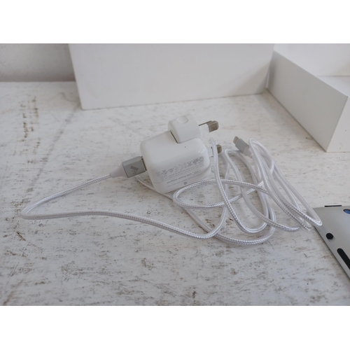 A boxed Apple Fourth Generation iPad with charger