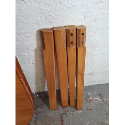 18 - A teak oval dining table - approx. 112cm wide x 210cm long