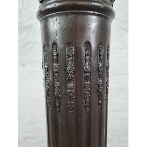 45 - A bronze effect Corinthian column jardinière stand - approx. 104cm high