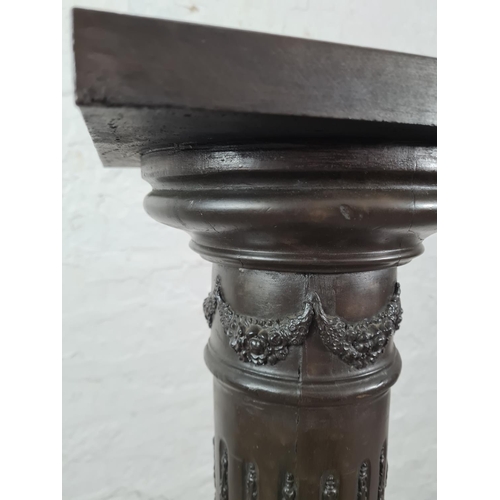 45 - A bronze effect Corinthian column jardinière stand - approx. 104cm high