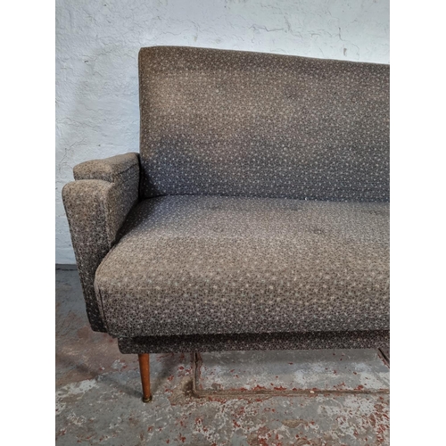 140 - A mid 20th century grey upholstered sofa bed - approx.  100cm high x 210cm wide x 80cm deep