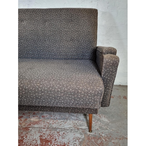 140 - A mid 20th century grey upholstered sofa bed - approx.  100cm high x 210cm wide x 80cm deep