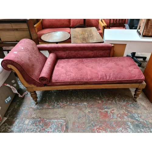 183 - An Edwardian style beech and red upholstered chaise longue