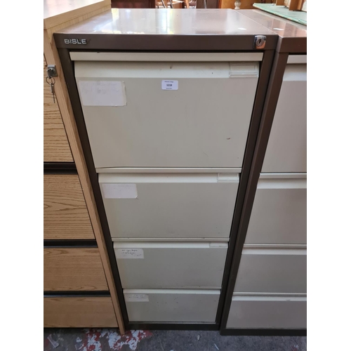 187 - A Bisley brown and cream metal four drawer office filing cabinet - 133cm high x 47cm wide x 62cm dee... 