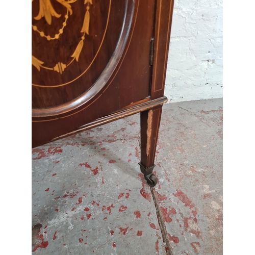 191 - An Edwardian inlaid mahogany pot cupboard with tapering supports and castors - approx. 69cm high x 4... 