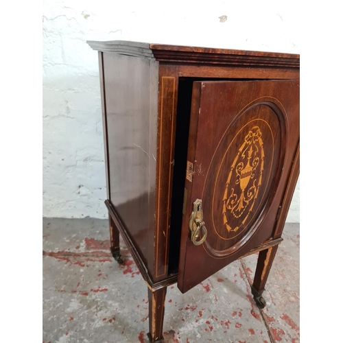 191 - An Edwardian inlaid mahogany pot cupboard with tapering supports and castors - approx. 69cm high x 4... 