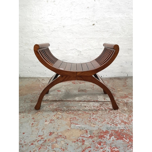 216 - Two Indonesian solid teak kartini chairs, one double - approx. 68cm high x 138cm wide x 37cm deep an... 