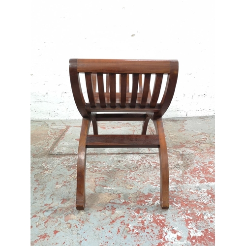 216 - Two Indonesian solid teak kartini chairs, one double - approx. 68cm high x 138cm wide x 37cm deep an... 