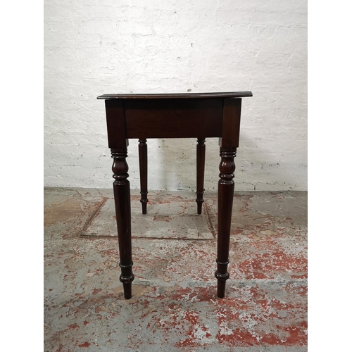 219 - A 19th century mahogany two drawer writing table with blue leather insert - approx. 75cm high x 90cm... 