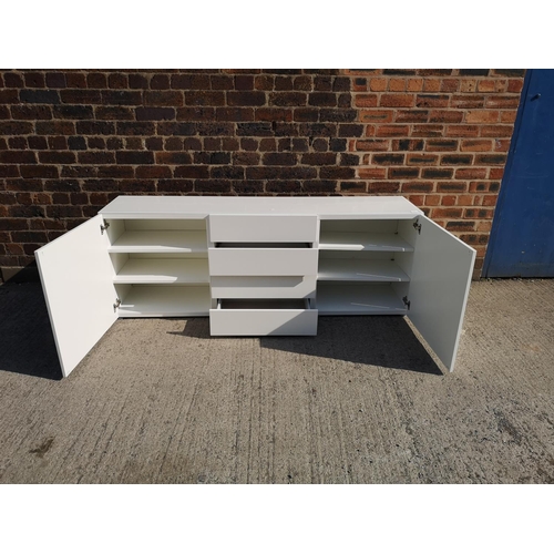 224 - A contemporary white painted sideboard with four central drawers and two outer cupboard doors - appr... 