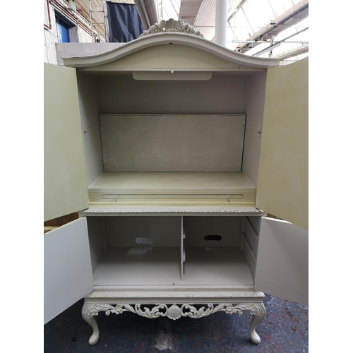 232 - A French style white painted four door cabinet with cabriole supports - approx. 173cm high x 97cm wi... 