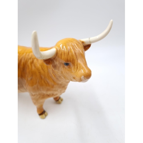 1127 - A three piece Beswick Highland cattle family