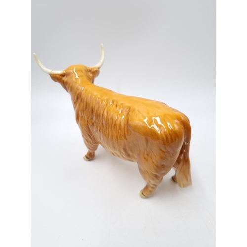 1127 - A three piece Beswick Highland cattle family