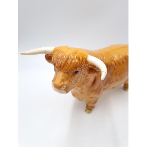 1127 - A three piece Beswick Highland cattle family