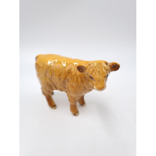 1127 - A three piece Beswick Highland cattle family