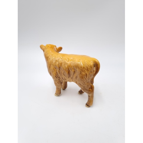 1127 - A three piece Beswick Highland cattle family