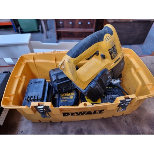 496 - A large collection of assorted tools to include boxed Wickes WPBS800 240V sander, DeWalt DW005 24V c... 