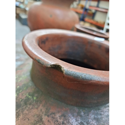 504 - Three matching terracotta planters - approx. 65cm high