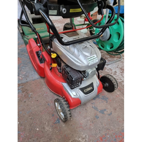 505 - Two lawn mowers, one Cobra electric start 135CC with ignition key, charger and instruction manual  a... 