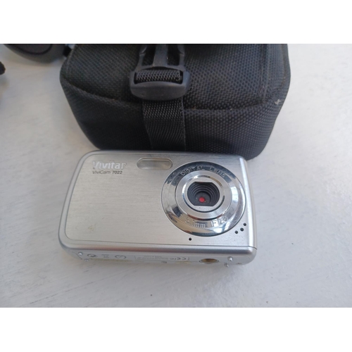 311 - A collection of cameras and optical equipment to include Casio EX-Z850 Exilim 8.1MP digital camera, ... 